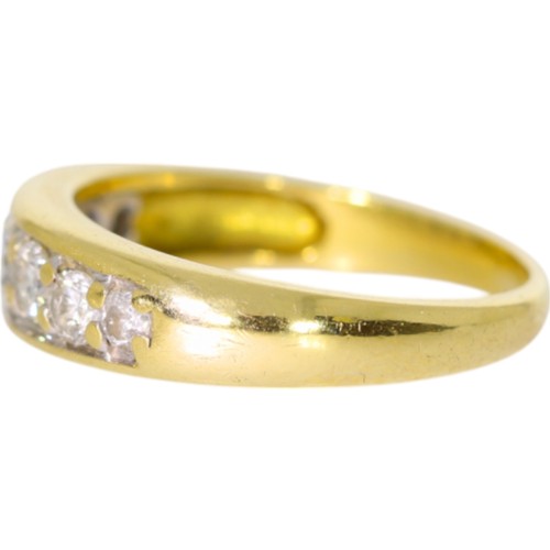 254 - An 18ct yellow gold diamond half-eternity ring. Set with brilliant cut diamonds of 0.90ct total calc... 