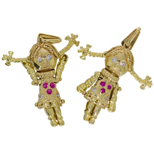 393 - 9ct yellow gold rag doll pendant with pink and clear gemstones. 3cm in length and 2.35g