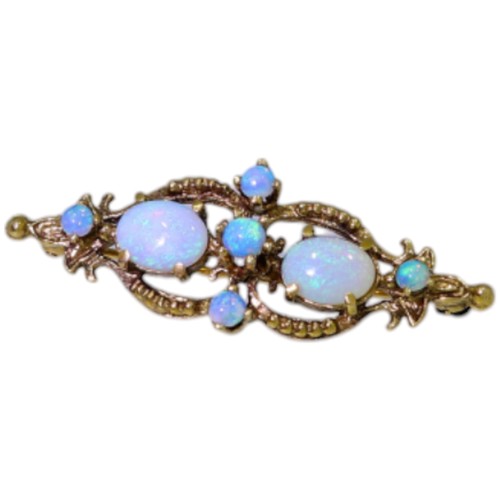 367 - 9ct gold opal brooch. Set with seven bright lively opals. Weight 5g. Hallmarked London.  Good, weara... 