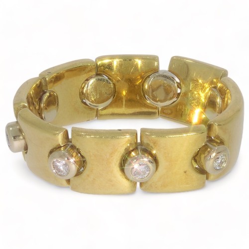 A 18ct yellow and white gold diamond set loose panel set dress ring 
8 stones, Round brilliant cut. Colour: G/H. Clarity: VSI/VS2. (assessed) Length 2.10mm; width 2.10mm; depth 1.26mm
Weight 0.032ct (estimated) each stone; total weight 0.256ct
White metal, Collet
Length 23.5mm; width 6.7mm
Yellow/white metal, Full width. Polished
Yellow/white metal, 'D' section. Polished. Width 6.7mm; depth 3.2mm
Gross Weight 9.18 grams. Manufacture: Cast and handmade parts Hallmarked, Gold, 18ct, London 2002. Maker/Sponsor: M& W (Mappin & Webb)
Finger Size N