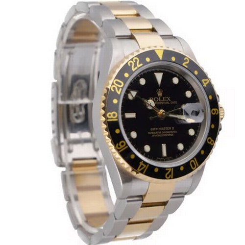 47 - A striking Rolex GMT-Master II automatic wristwatch, reference 16713,
manufactured in 2004. This des... 