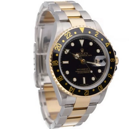 47 - A striking Rolex GMT-Master II automatic wristwatch, reference 16713,
manufactured in 2004. This des... 