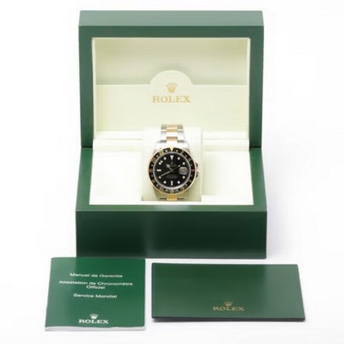 47 - A striking Rolex GMT-Master II automatic wristwatch, reference 16713,
manufactured in 2004. This des... 