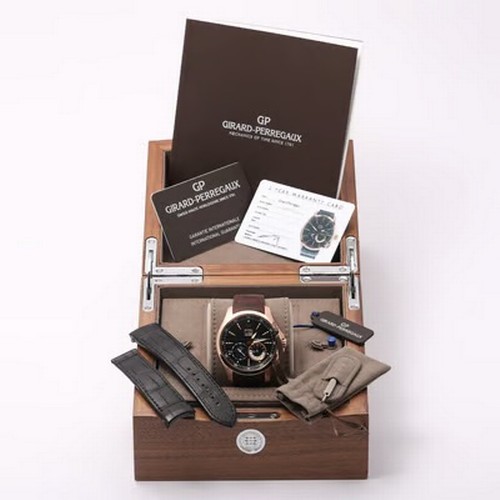 65 - A highly complicated and elegant Girard-Perregaux Traveller Large Date Moonphase GMT wristwatch, ref... 