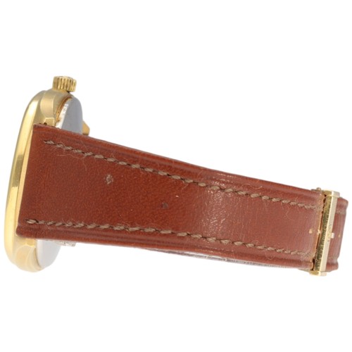 20 - Girard-Perregaux wristwatch, reference 4253-TA, featuring a gold-plated tonneau-shaped case. 

This ... 