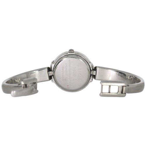 22 - Gucci 1400L

A ladies' Gucci wristwatch, reference 1400L, featuring a 25mm stainless steel case inte... 