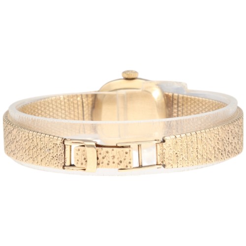 30 - A vintage ladies' 9ct gold Longines manual wind wristwatch, circa 1970. The cushion-shaped dial with... 