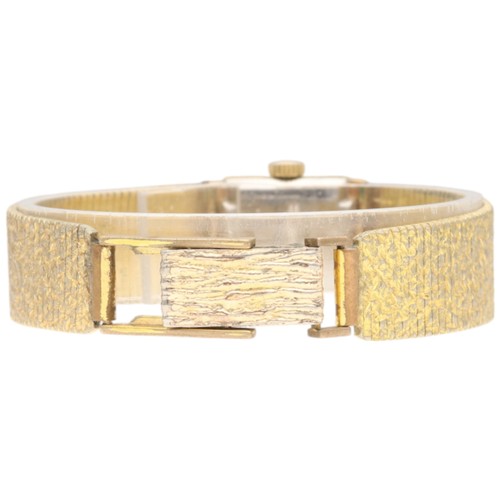 8 - Bucherer Ladies' Dress Watch – Textured Bracelet
Movement: Swiss Manual Wind (likely 17-Jewel)
Mater... 