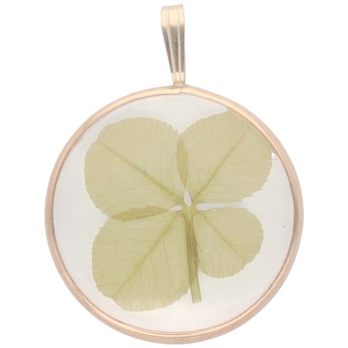 196 - 9ct Yellow Gold Botanical Specimen Pendant
A circular double-sided pendant featuring a naturally pre... 