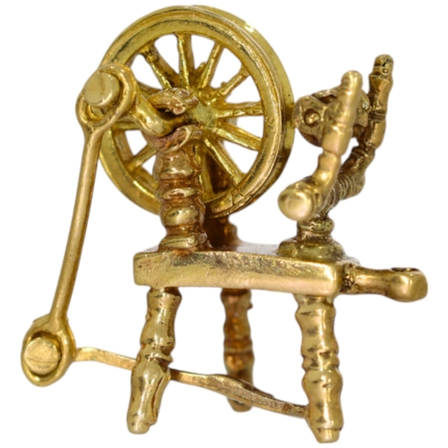 227 - 9ct spinning wheel charm. 2.7 Grams