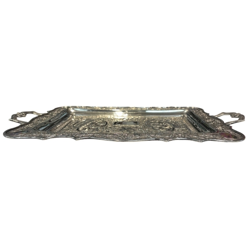 239 - A large mid-20th century Persian (Iranian) silver tray, likely Isfahan. Of rectangular form with rou... 
