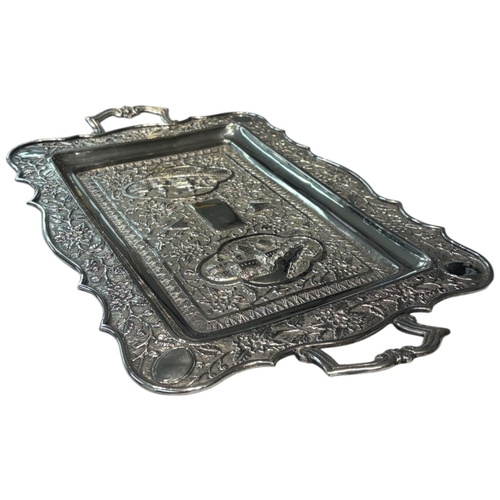 239 - A large mid-20th century Persian (Iranian) silver tray, likely Isfahan. Of rectangular form with rou... 