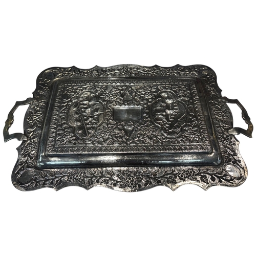 239 - A large mid-20th century Persian (Iranian) silver tray, likely Isfahan. Of rectangular form with rou... 