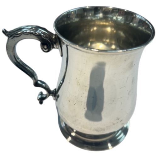 242 - A Victorian sterling silver tavern mug by Wolfe & Dobb, London, 1861. Baluster form with ornate doub... 