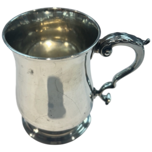 242 - A Victorian sterling silver tavern mug by Wolfe & Dobb, London, 1861. Baluster form with ornate doub... 