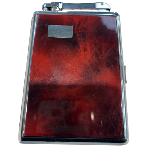 254 - A sophisticated Mid-Century Colibri combination lighter and cigarette case, circa 1950. Finished in ... 