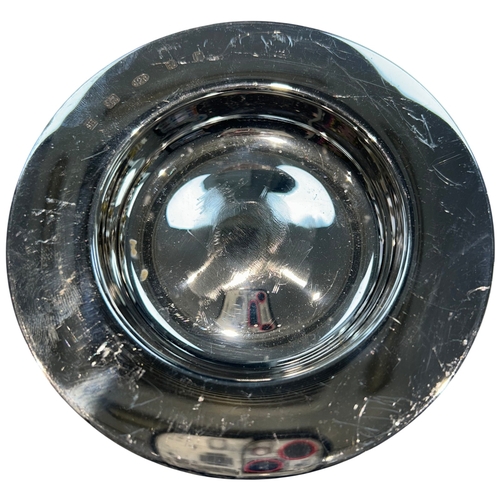 256 - A modern Elizabeth II sterling silver dish of circular form, featuring a broad rim and a deep, polis... 