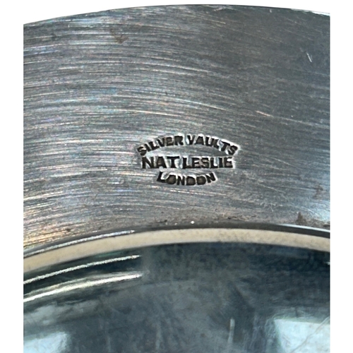 258 - An Elizabeth II sterling silver presentation dish of substantial gauge and circular form. The piece ... 