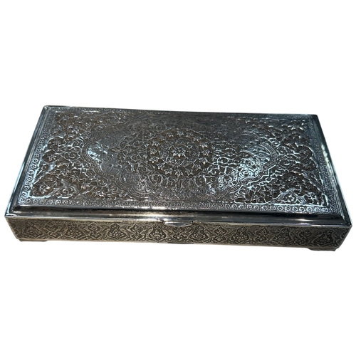 267 - A fine mid-century Persian silver cigarette box, Iran, circa 1950. The rectangular box features mast... 
