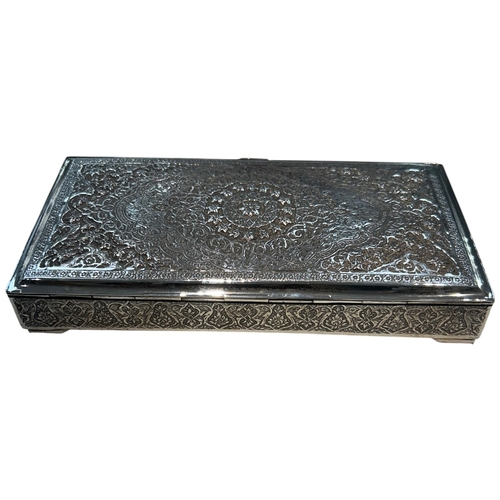 267 - A fine mid-century Persian silver cigarette box, Iran, circa 1950. The rectangular box features mast... 