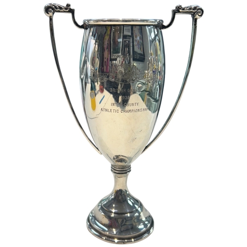 275 - A fine WWI-era sterling silver sports trophy, hallmarked London, 1913. Of traditional two-handled fo... 