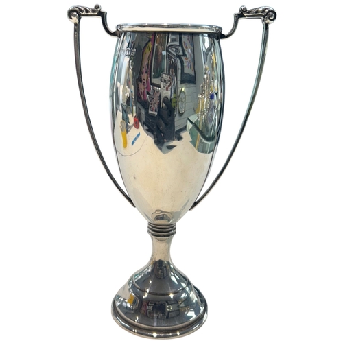 275 - A fine WWI-era sterling silver sports trophy, hallmarked London, 1913. Of traditional two-handled fo... 