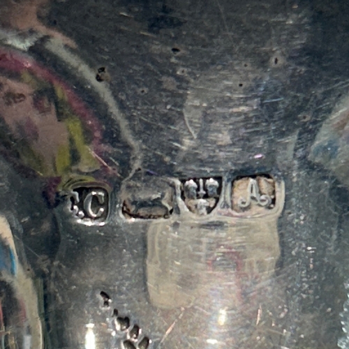 278 - An Edwardian sterling silver trumpet vase of slender form, featuring a flaring rim and a weighted ci... 