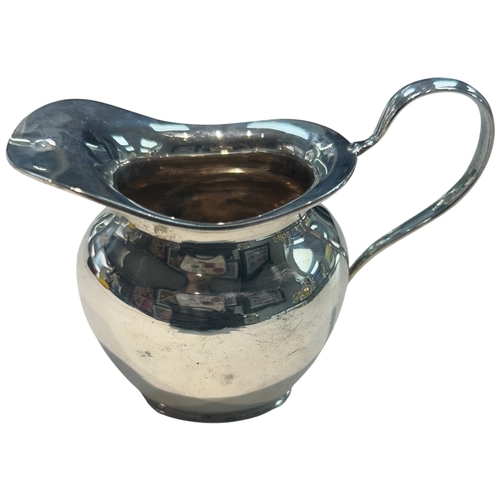 279 - A George V sterling silver cream jug of bulbous circular form, hallmarked Birmingham, 1930, by A.G. ... 