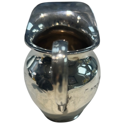 279 - A George V sterling silver cream jug of bulbous circular form, hallmarked Birmingham, 1930, by A.G. ... 
