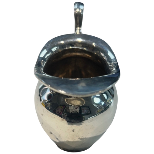 279 - A George V sterling silver cream jug of bulbous circular form, hallmarked Birmingham, 1930, by A.G. ... 