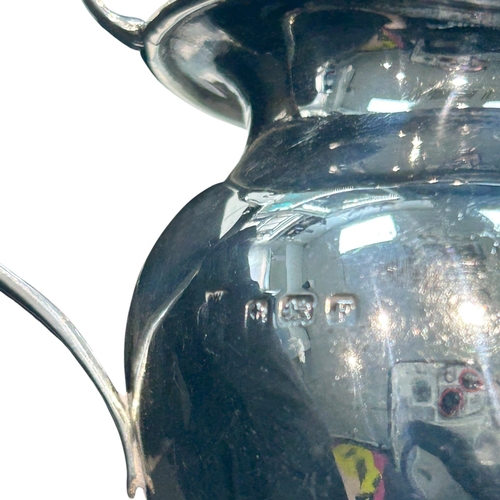 279 - A George V sterling silver cream jug of bulbous circular form, hallmarked Birmingham, 1930, by A.G. ... 