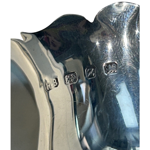 285 - A fine Late Victorian sterling silver cream jug of bulbous circular form, featuring a traditional 