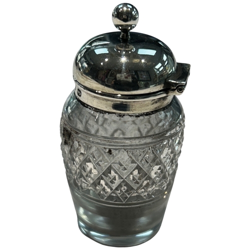 289 - A charming collection of three late Victorian and Edwardian silver-mounted glass vanity jars by the ... 