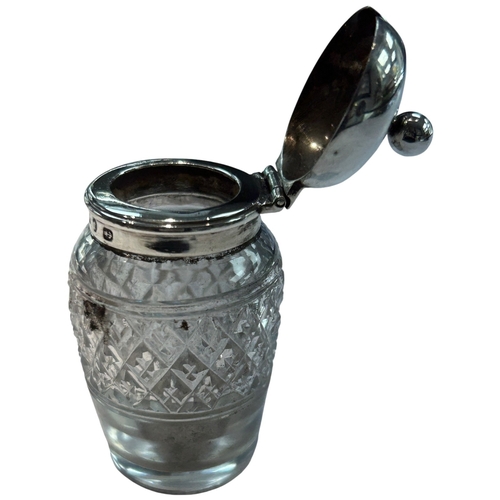 289 - A charming collection of three late Victorian and Edwardian silver-mounted glass vanity jars by the ... 