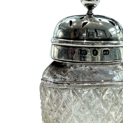 289 - A charming collection of three late Victorian and Edwardian silver-mounted glass vanity jars by the ... 