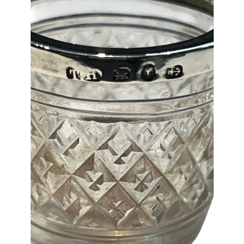 289 - A charming collection of three late Victorian and Edwardian silver-mounted glass vanity jars by the ... 
