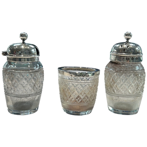 289 - A charming collection of three late Victorian and Edwardian silver-mounted glass vanity jars by the ... 