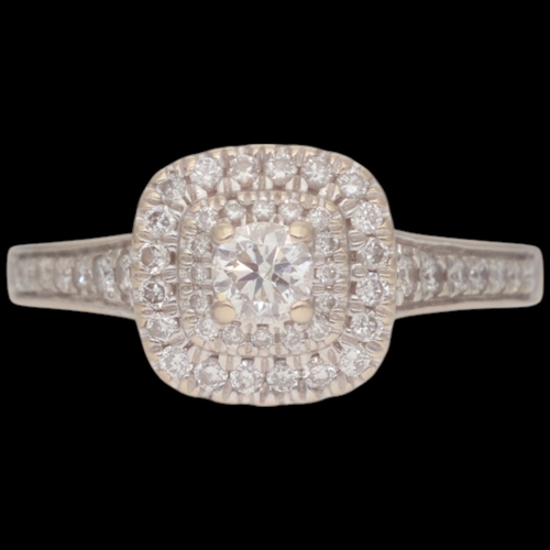 81 - 18ct White Gold Diamond Double Halo With Set Shoulders Weight 3.7 Grams Finger Size K  Set with a pr... 