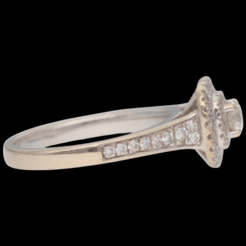 81 - 18ct White Gold Diamond Double Halo With Set Shoulders Weight 3.7 Grams Finger Size K  Set with a pr... 