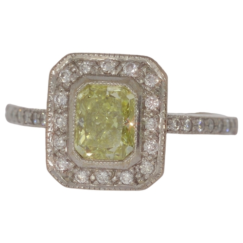 84 - 18ct Gold Ring With Yellow Diamond 5.5 Grams Size R Set with a principle radiant cut diamond of 1.64... 