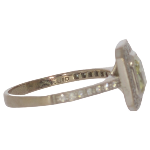 84 - 18ct Gold Ring With Yellow Diamond 5.5 Grams Size R Set with a principle radiant cut diamond of 1.64... 