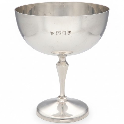 An Elizabeth II sterling silver trophy cup by Garrard & Co Ltd, Crown Jewellers, hallmarked London, circa 1962, the base engraved "Garrard & Co, 112 Regent Street". Maker: Garrard & Co Ltd. Origin: London, England. Material: Sterling Silver (.925). Period: Elizabeth II (circa 1962). Dimensions: Diameter 10.3cm, height 12.5cm. Weight: 175g. Condition: Please refer to images or view in person.