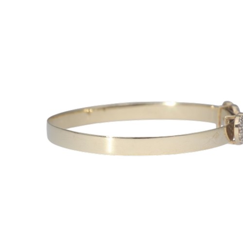 1 - A yellow metal tested as 9ct cz's heart bangle baby bangle. Weighing 3.47g.