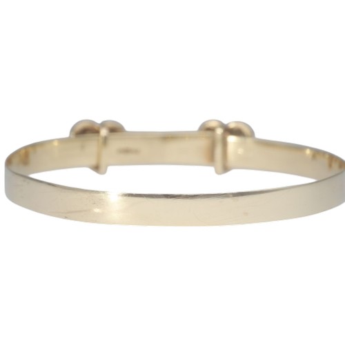 2 - A yellow metal tested as 9ct CZ's heart bangle baby bangle. Weighing 3.66g.