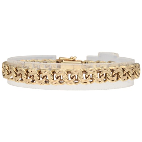 9 - A yellow metal stamped and tested 14k bracelet. Weighing 27.1g. Length: 8 inches.
