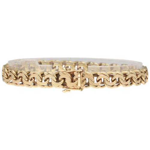 9 - A yellow metal stamped and tested 14k bracelet. Weighing 27.1g. Length: 8 inches.