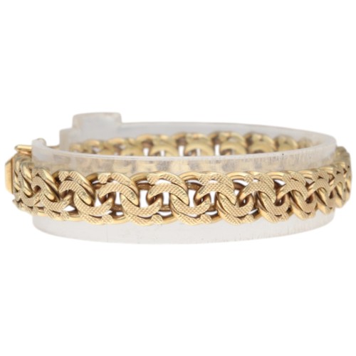 9 - A yellow metal stamped and tested 14k bracelet. Weighing 27.1g. Length: 8 inches.