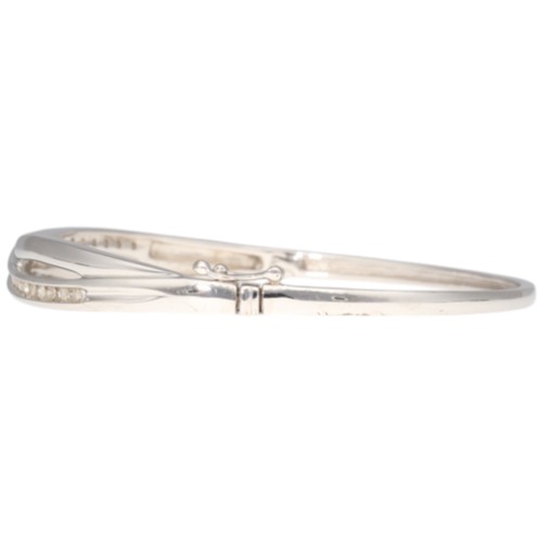 11 - 9CT White Gold Hinged Bangle Diamond. Set with eight cut diamonds of 0.50ct total estimated weight, ... 