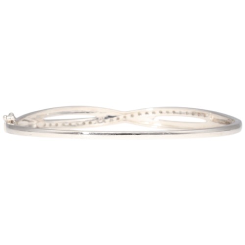 11 - 9CT White Gold Hinged Bangle Diamond. Set with eight cut diamonds of 0.50ct total estimated weight, ... 