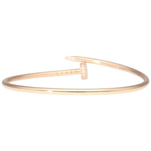 12 - An 18ct rose gold nail-design open bangle. Weighing 9.1g size 15.